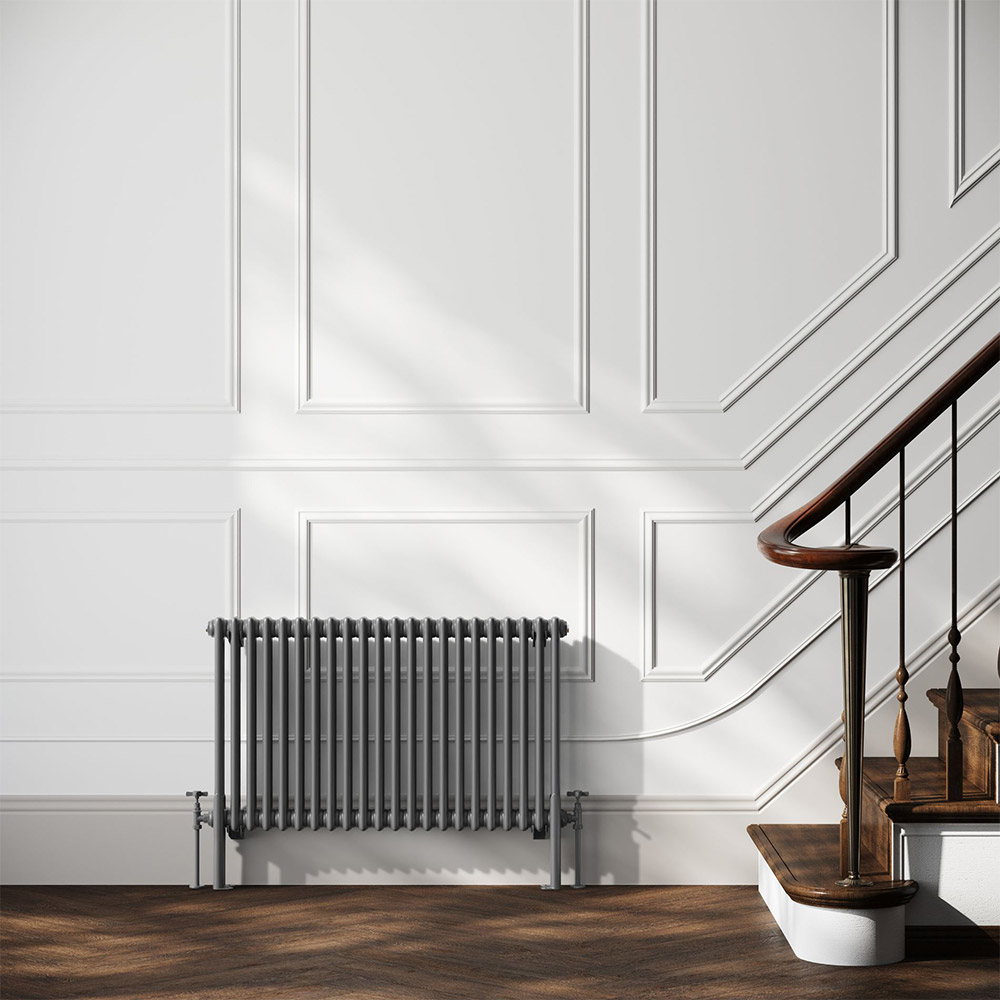 grey radiator in a light grey and brown room with a staircase