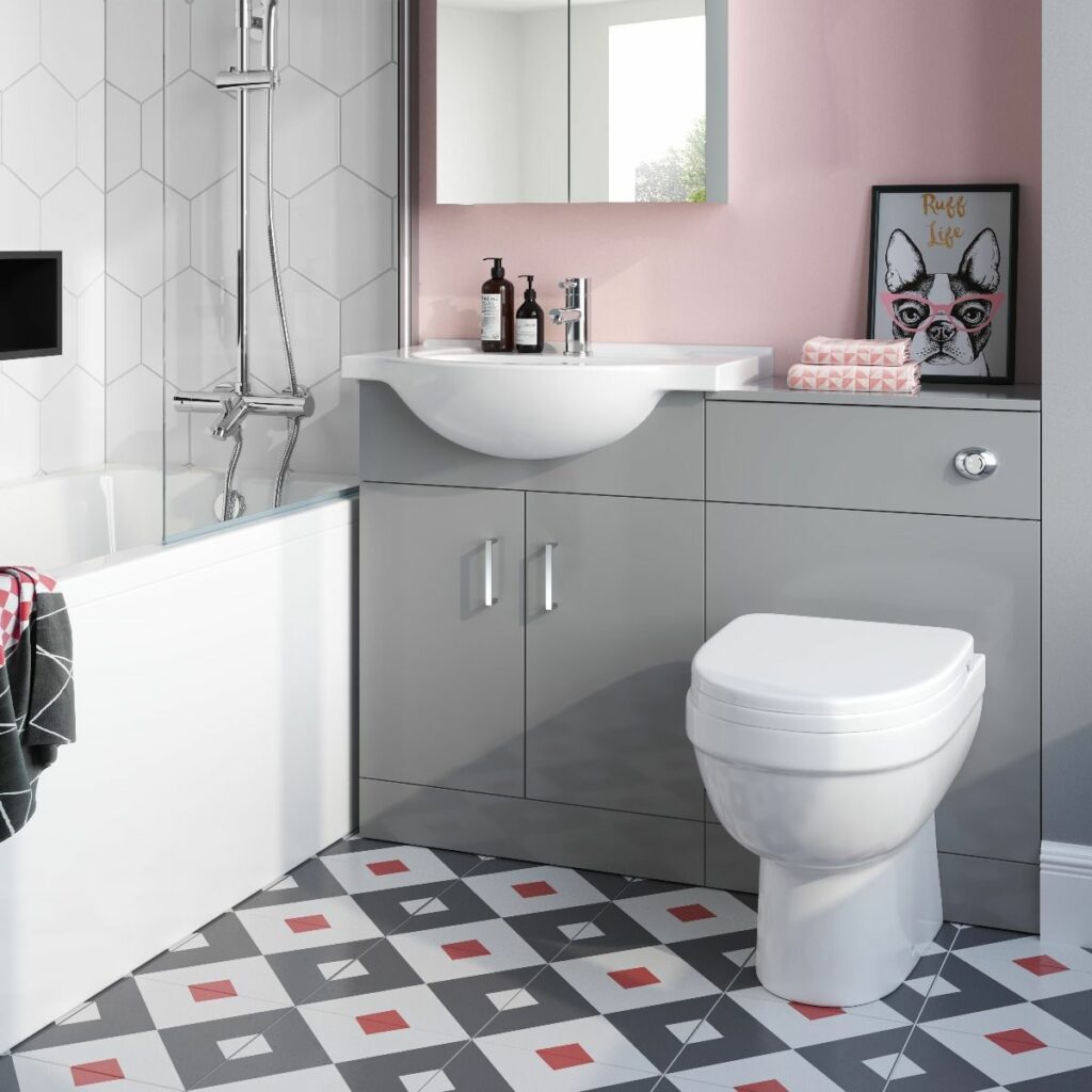 grey unit against a pink wall, grey and red triangular flooring