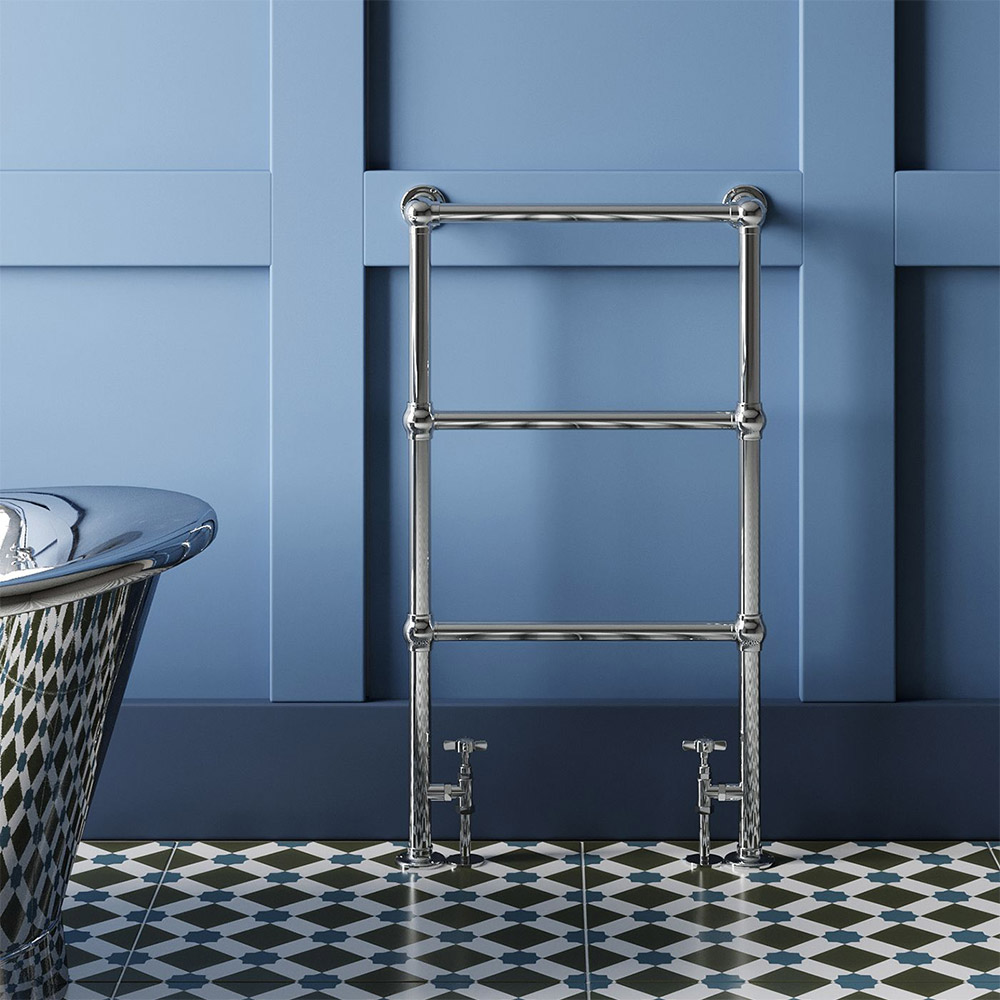 chrome towel rail against a blue wall with a blue, black and white