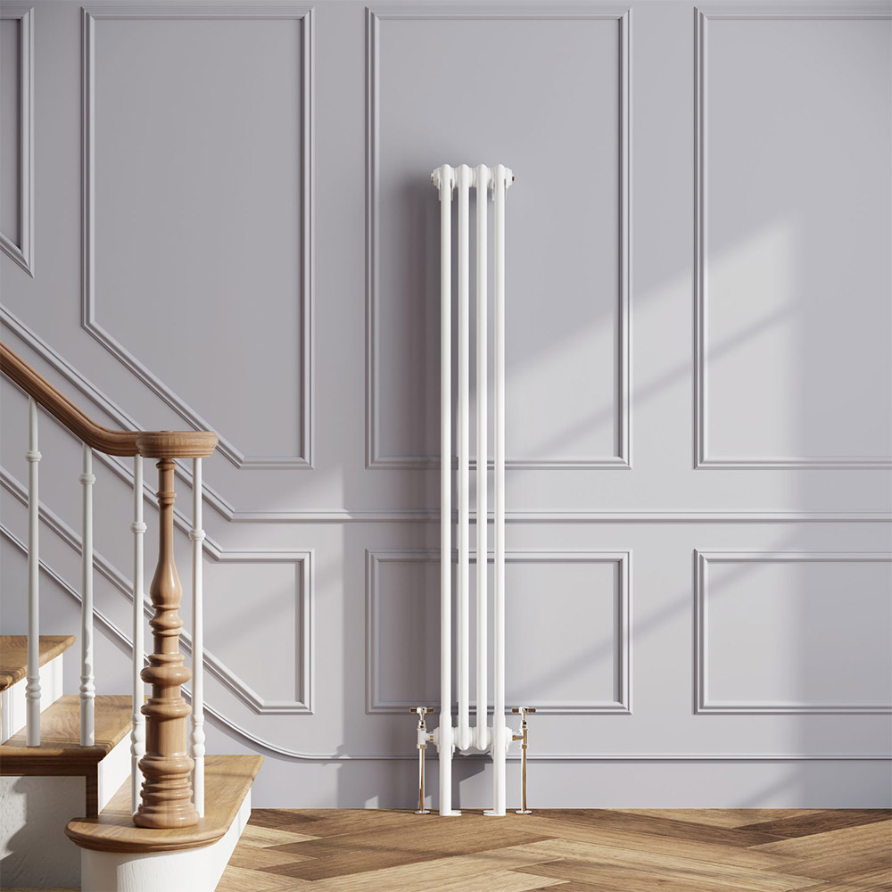 Thin white radiator against a grey wall with a white and wooden staircase