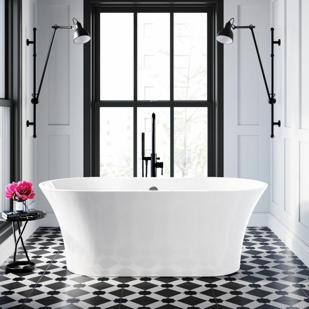 strand 1600mm freestanding bath in white acrylic placed in a monochrome bathroom