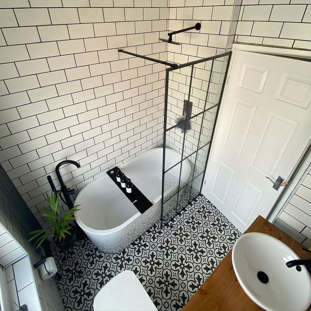 bathroom with patterned floor and joint shower and bath  