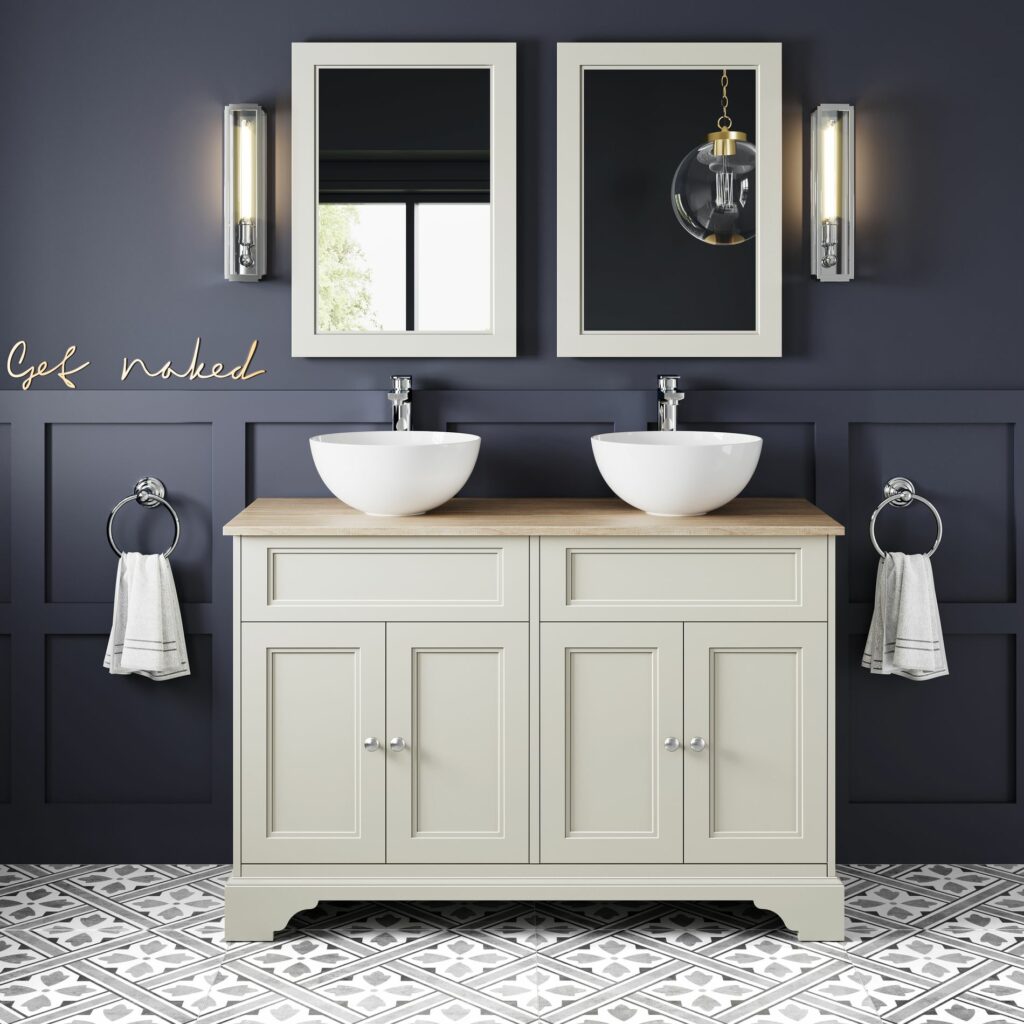 dark blue bathroom with a combined vanity unit